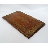 A ladies late 18th / early 19th  leather covered writing folder with gold tooled decoration to the