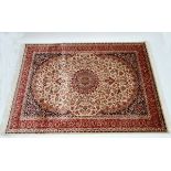 Carpet / rug :  a Keshan carpet with beige ground , black, red, and dark mustard colours , 95"x 62"