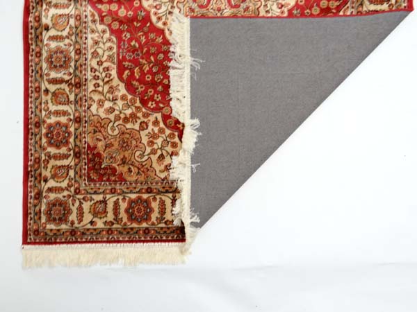 Carpet / rug : a Kum carpet with red ground , central biege medallion having foliate decoration, - Image 3 of 3