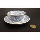 A 19thC childs blue and white transfer printed cup and saucer. With image of horseman and dogs in