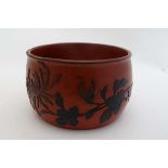 A c.1900 Japanese lacquered open circular pot with floral and foliate relief decoration to sides. 2"