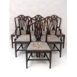 A Set 6 (4+2) Hepplewhite style early 20thC mahogany dining chairs with needlework covered drop in