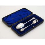 A cased silver Christening set comprising silver spoon and fork . Hallmarked Sheffield 1903 maker