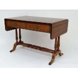 A c.1900 mahogany sofa table with boxwood inlay, twin drawers, drop flap ends, twin turned stretcher