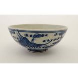 A  Chinese blue and white porcelain bowl. Decorated with oriental birds in flight. Four Chinese