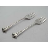 A pair of silver onslow pattern butter / savoury forks hallmarked London 1894 maker Goldsmiths &