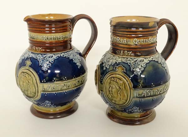 A Pair of Royal Doulton Lambeth stoneware commemorative jugs. Commemorating the Diamond Jubilee of