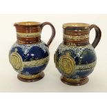 A Pair of Royal Doulton Lambeth stoneware commemorative jugs. Commemorating the Diamond Jubilee of