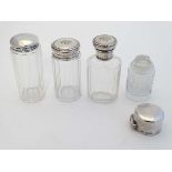 4 various silver topped glass dressing table bottles including 2 hallmarked Birmingham 1912 maker