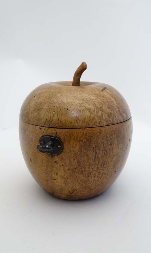 A pear wood tea caddy in the form of a Regency apple caddy. 5" high x 4 1/4" diameter   CONDITION:
