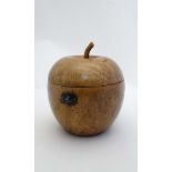 A pear wood tea caddy in the form of a Regency apple caddy. 5" high x 4 1/4" diameter   CONDITION: