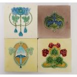 A group of four Art Nouveau majolica tiles. With raised floral designs. To include a bluebell design