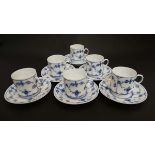 A set of 6  Royal Copenhagen '' onion '' pattern cups and saucers. Saucers 3 1/2'' diameter. Cups