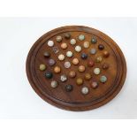 A Husky solitaire wooden games board with original marbles. In original box  with Husky