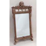 A Contemporary 19thC style gilt framed bevelled edge wall mirror, the top with lions mask and paw