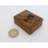 A Victorian hand carved walnut sewing / pin box with carved relief floral image of eidlewiess to top