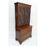 A Georgian bookcase chest having a satinwood cross banding boxwood and ebony stringing and pair of