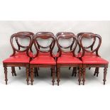 A set of 8 Victorian mahogany balloon back  dining chairs with red leather covered drop in seats