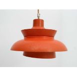 Vintage Retro : a Danish pendant light with burnt orange outer and white inner finish , of two