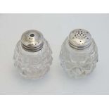 A glass and silver salt and pepper cruet set, the glass pots with Sterling Silver tops. Each