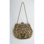 A Ladies c1920's evening bag, gold wire work embroidery on a cream grosgrain background. Cream