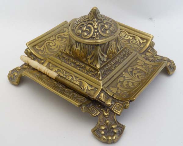 A Victorian cast brass inkwell / Standish of squared form with relief decoration having hinged - Image 4 of 7