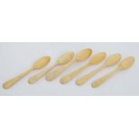 A set of 6 bone egg spoons 4 5/8" long  CONDITION: Please Note -  we do not make reference to the