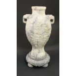 A Chinese / Burmese Jadeite baluster shaped vase with circular stand, the vase having carved