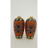 A pair of vases decorated in Imari style colours. 6 1/2'' high CONDITION: Please Note -  we do not