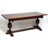 Bevin Funnel : An early - mid 20thC oak refectory table with cup and cover carved pedestals to