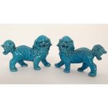 A pair of turquoise glazed Dogs of Fo. Indistinct impressed marks to base. 4'' High CONDITION: