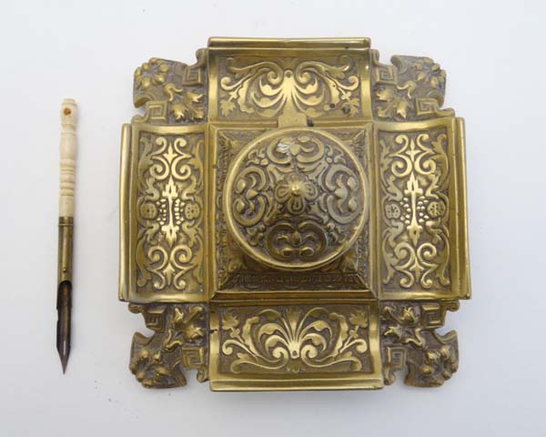 A Victorian cast brass inkwell / Standish of squared form with relief decoration having hinged - Image 7 of 7