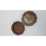 Arts and Crafts : A pair of circular wavy edged dishes with hammered decoration to centre marked '