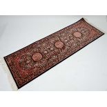 Carpet / rug :  a Keshan runner with blue ground having beige, reds, and mustards colours , 82 1/2 x