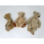 A group of three 1950s teddy bears . To Include a Merrythought gold mohair teddy bear. With felt