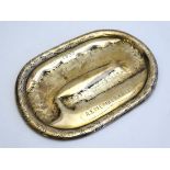 Airship : A commemorative brass plate decorated with image of the R101 (G-EAAW) airship, marked '