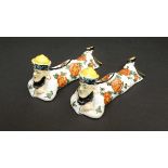 A pair of Au Seures knife rests styled as two Mandarin figures. 2'' high x 4 1/2'' long CONDITION: