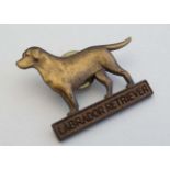 A Vintage brooch / pin with images of dog and labelled ' Labrador Retriever '  1 1/2" wide