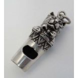 A novelty silver whistle with cat head decoration. Marked ' Sterling ' 1 1/4" long  CONDITION: