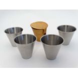 A cased set of 4 stainless steel beakers contained within a leather case 3 1/2" high  CONDITION: