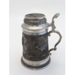 Stag / Deer hunting: A pewter Stein with cast decoration depicting Continental huntsman, stags and