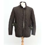 Country clothing : a Barbour Chelsea quilted jacket , size M , together with a pair of Barbour