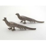 A pair of white metal table card / menu holders formed as peacocks  5" long  CONDITION: Please