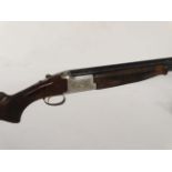 Shotgun : A Browning , USA 52512 bore boxlock ejector (BLE) over and under shotgun , single gold