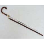 Collectors Antique Sword Stick : a bamboo and brass Crook handled 19 th C Sword Stick with squared
