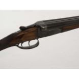 Shotgun : A Belgian .410 boxlock (BLNE) side by side shotgun , 14 1/2" chequered straight hand