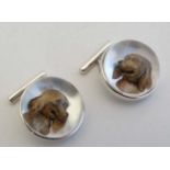 A pair of 'Sterling' silver cufflinks set with Essex crystal cabochon with dog head decoration.