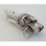 A .925 silver whistle with dog head decoration 2" long  CONDITION: Please Note -  we do not make