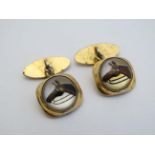 A pair of gilt metal cufflink set with Essex Crystal cabachon depicting horse heads  CONDITION: