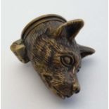 A novelty brass vesta case formed as the head of a dog with hinged lid to one end 1 1/4" long